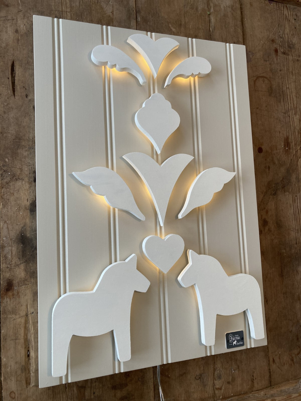 Vit på Leksandsgreige bakgrund